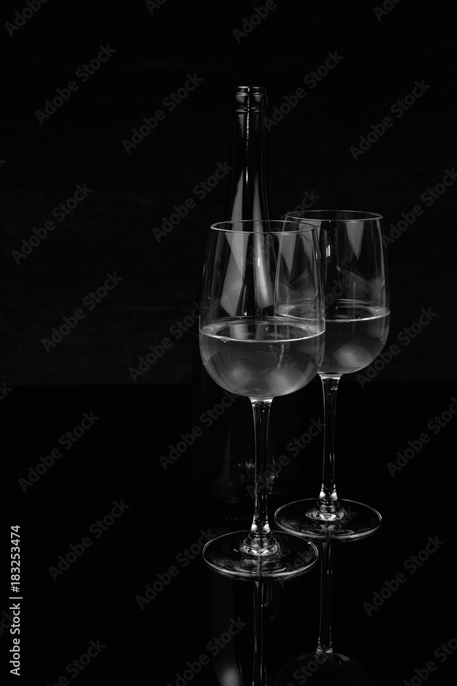 Two glasses and a bottle of white wine
