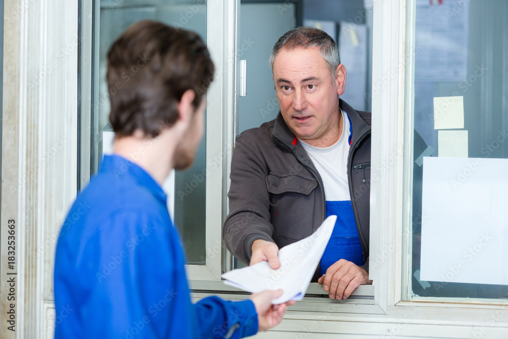 two careful workmen work at pvc windows factory two careful workmen work at pvc windows factory