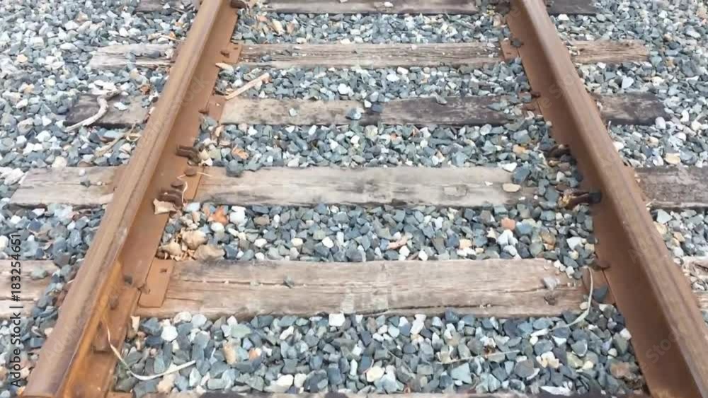 POV walking along railroad tracks looking down POV walking along railroad tracks looking down
