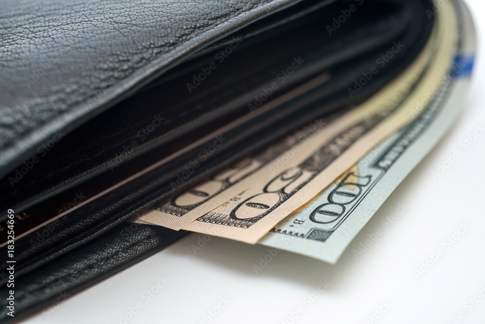 Dollar bills sticking out of the wallet Dollar bills sticking out of the wallet