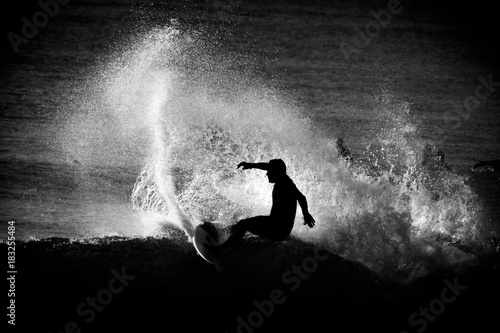silhouette of surfer early morning