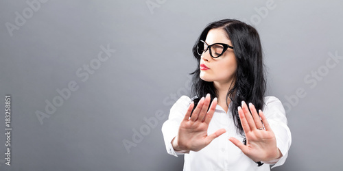 Young woman making a rejection pose a solid background photo