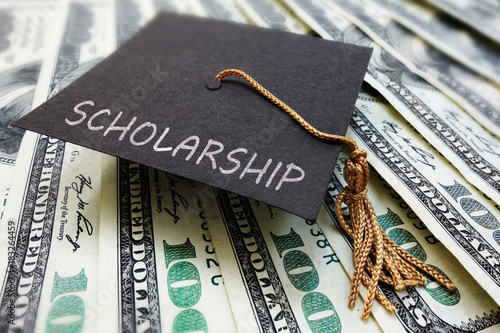 Scholarship cap on money photo