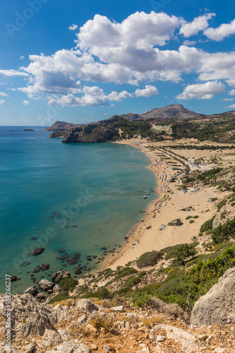 Stony landscape and a view of the Tsambika beach on the Rhodes Island, Greece