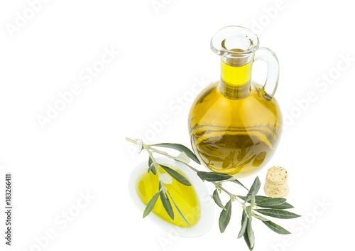 Olive oil Bottle and bowl plate with olive branch. Virgin olive oil. Natural olive oil, healthy food. Natural mediterranean food. Bread dipping.