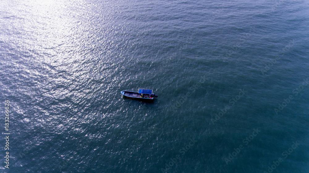A Small boat in the Vast Sea