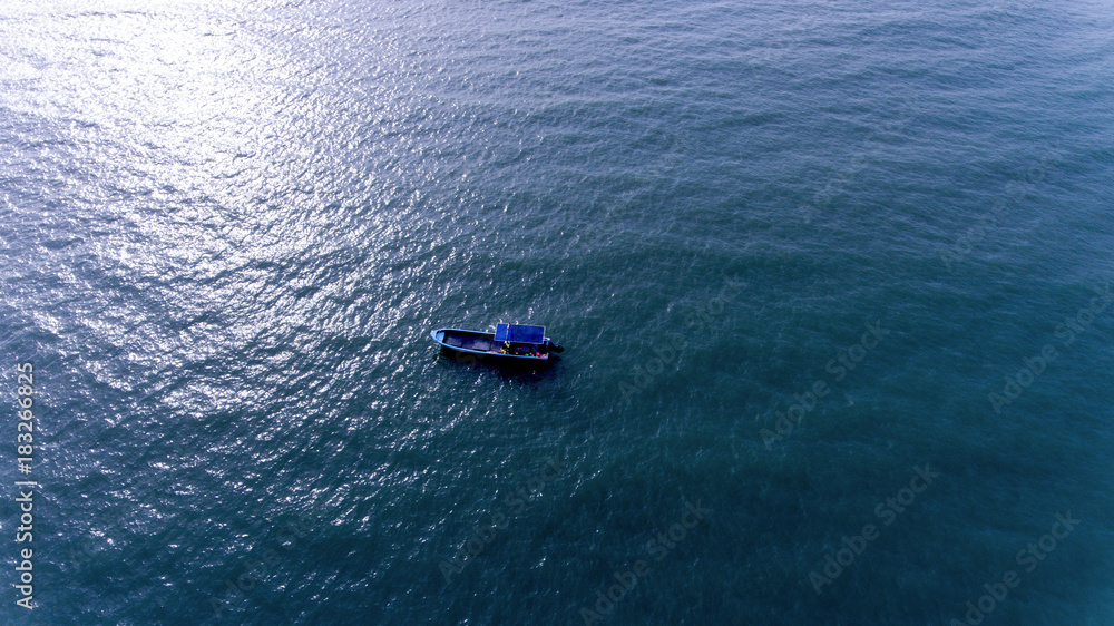 A Small boat in the Vast Sea