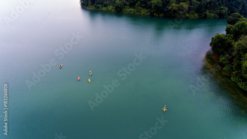 Canvas Print Kayaks on a Blue Lake