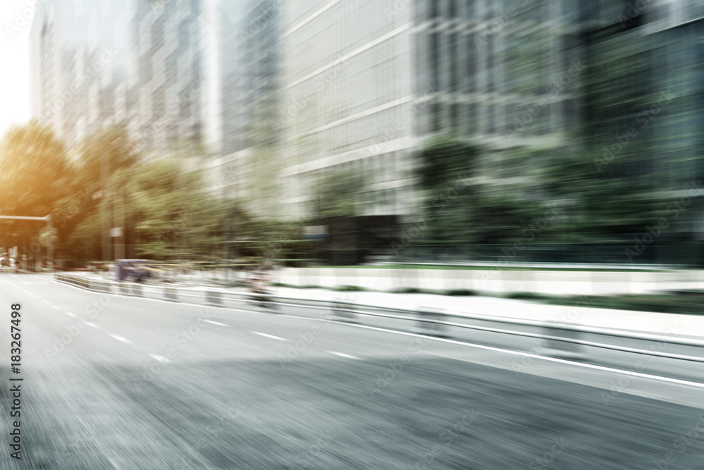 empty asphalt road in modern city with sunbeam empty asphalt road in modern city with sunbeam