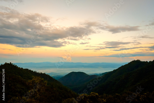 Fototapeta Naklejka Na Ścianę i Meble -  high mountains peaks range clouds in fog scenery landscape national park view outdoor  at Doi Ang Khang, Chiang Mai Province, Thailand