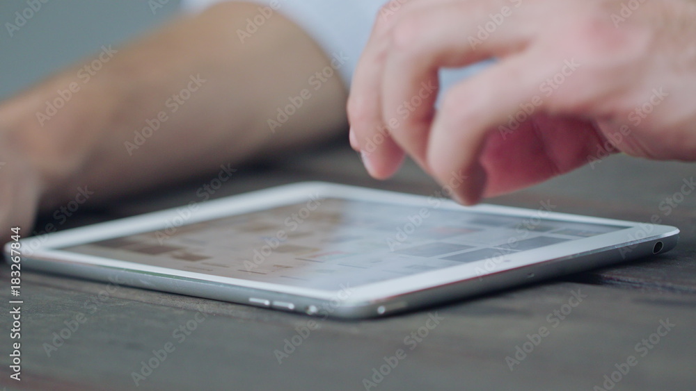 A young man's hands using a phone. Closeup macro shot. Soft Focus A young man's hands using a phone. Closeup macro shot. Soft Focus