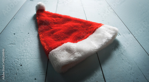 Santa hat on wooden background, photo