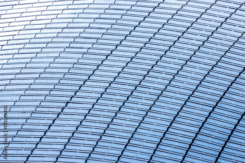 Top view of a building roof fully covered with solar panels