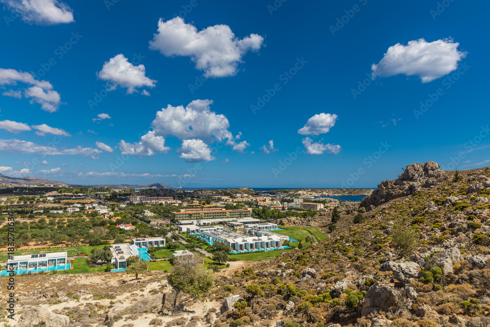 Stony landscape of Tsambika mountain and a view of Kolymbia, a small resort on the Rhodes Island, Greece. Stony landscape of Tsambika mountain and a view of Kolymbia, a small resort on the Rhodes Island, Greece.