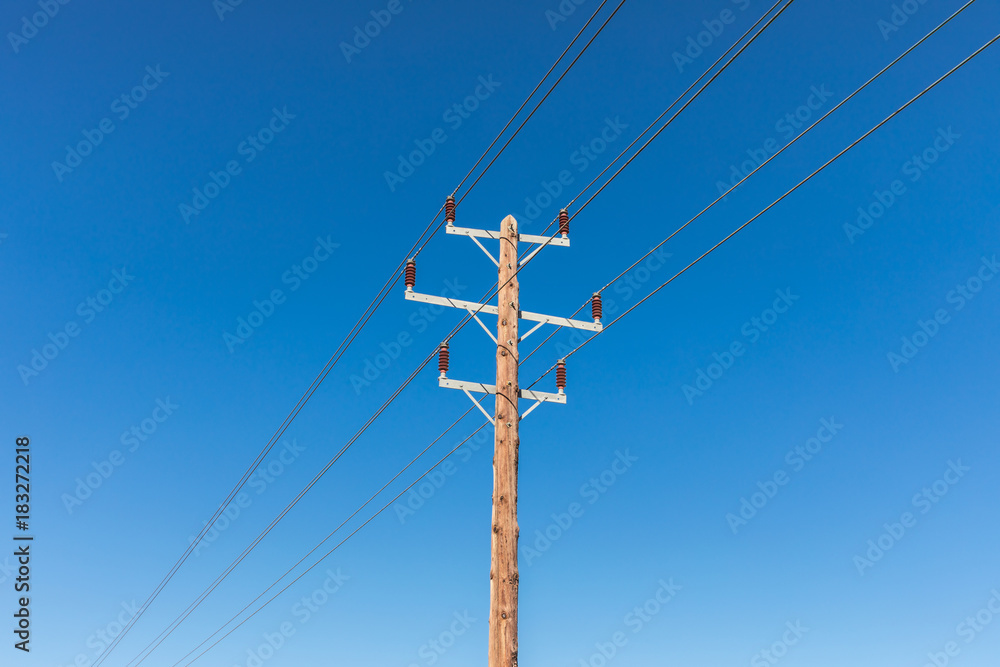 Obraz premium power lines on blue sky background