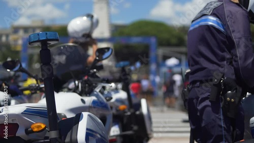 Several municipal patrol policemen dismounting from motorbikes, public order photo