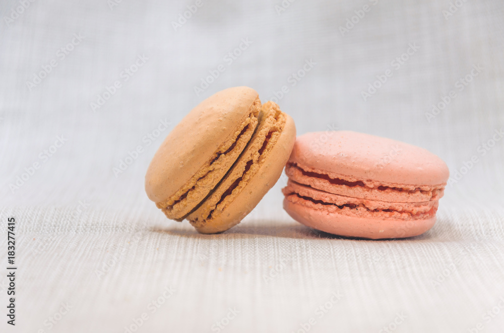 Delicious cake macaroons on light background, close up Delicious cake macaroons on light background, close up