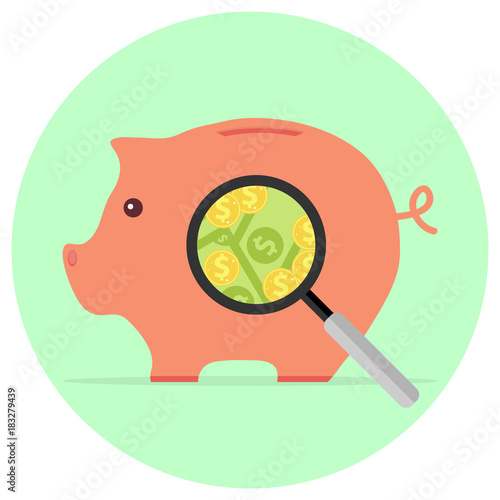 A magnifying glass looks at the pig piggy bank with money.
