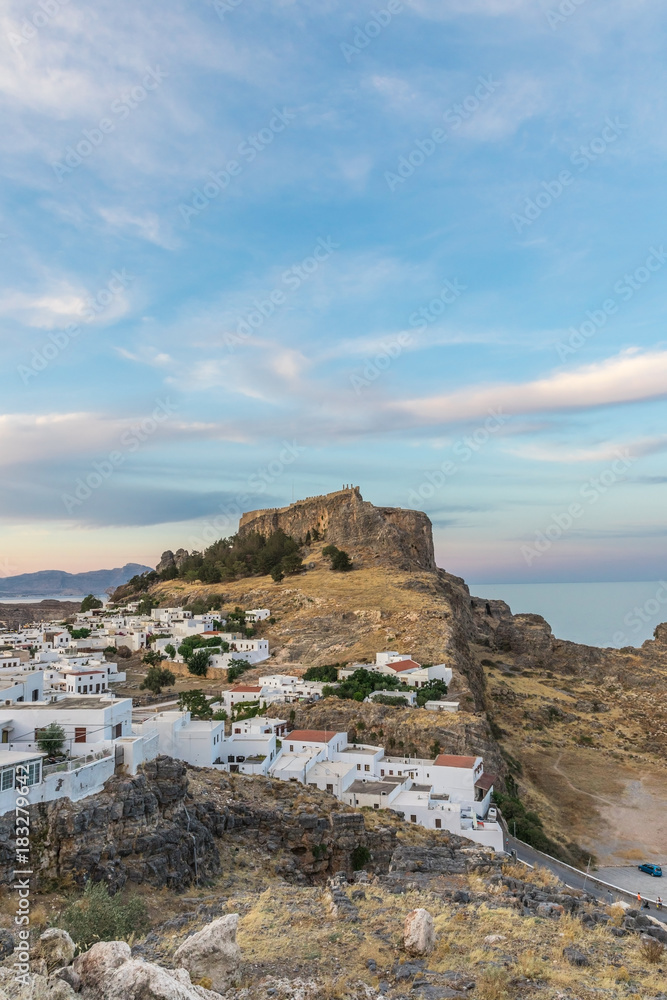 Lindos, a medieval village with small white houses on the hillside making it one of the most beautiful places on the island of Rhodes, Greece