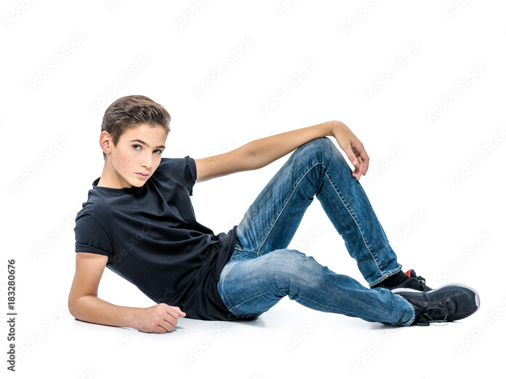 Photo of teenage handsome guy posing at studio Photo of teenage handsome guy posing at studio