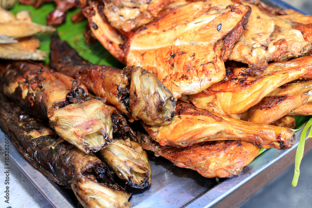 Thai style barbecue chicken, meat and entrails after grill on charcoal stove, Thai street food, street food in Thailand. Thai style barbecue chicken, meat and entrails after grill on charcoal stove, Thai street food, street food in Thailand.