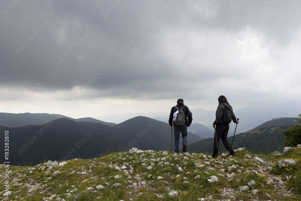 Fototapeta premium man and woman hikers on mountain