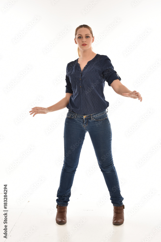 full length portrait of air wearing blue shirt and denim pants, standing pose on white background. full length portrait of air wearing blue shirt and denim pants, standing pose on white background.