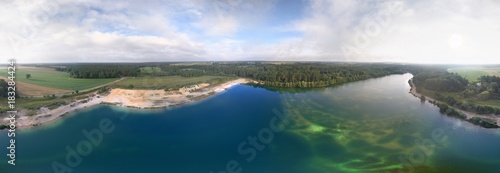 Wide panorama view from aerial photos of a lake in the Lüneburger Heide