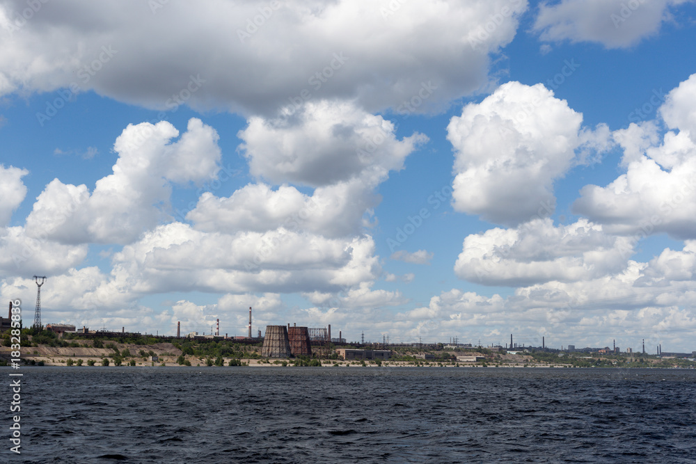 Blue sky, clouds, river and horizon