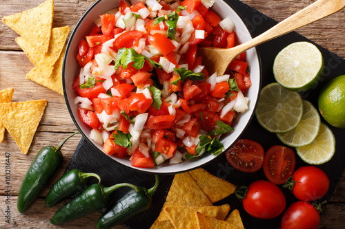 Canvas Print Mexican pico de gallo from tomatoes, onions, cilantro and jalapeno pepper close-up