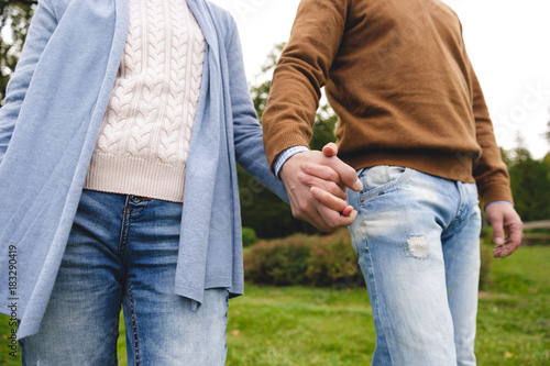 Cropped image of mature couple holding hands
