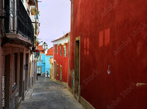 Colorful street in Alfama quarter, old picturesque part of Lisbon, Capital of Portugal