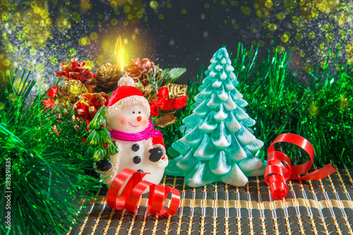 Christmas background with snowman and Christmas tree.