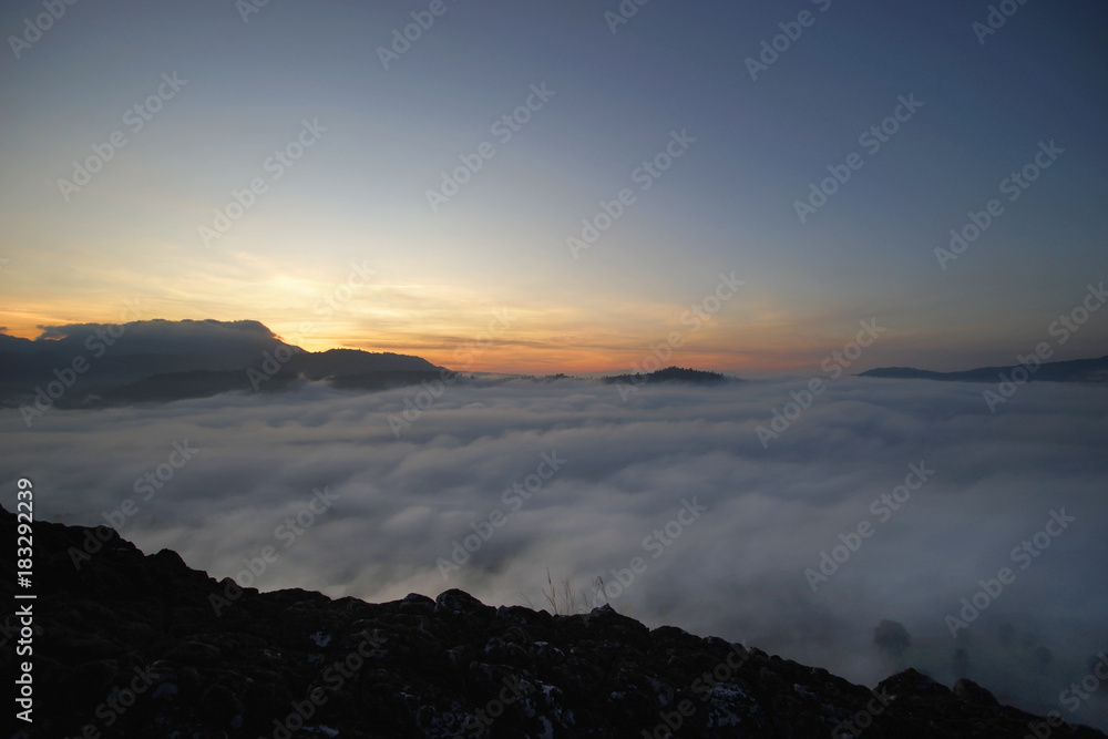 sunrise over the hills with sea fog