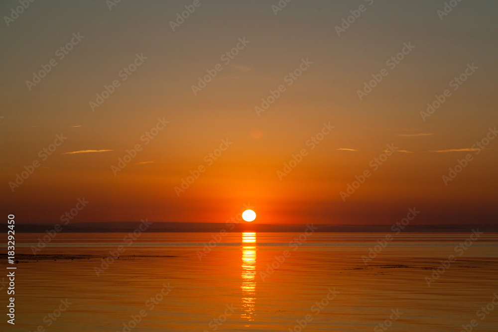 Naklejka premium Sunrise early in the morning over the sea