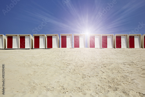 Cabins on the beach in the sand in sunny weather