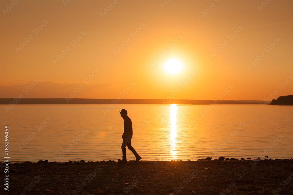 Man walking on seashore