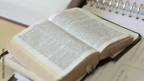 Close up of the Bible on textbook photo