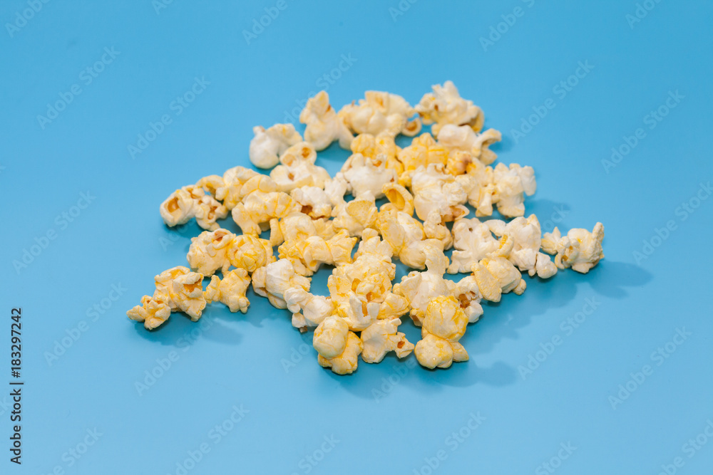 popcorn in wooden on blue background popcorn in wooden on blue background