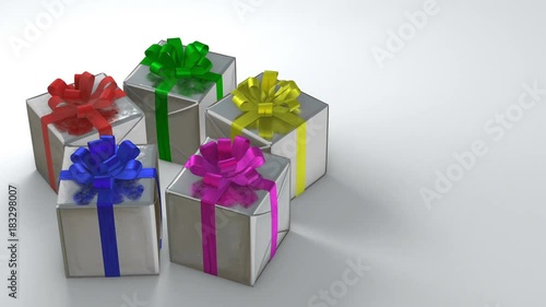 Silver gift boxes with colorful ribbons rotating in perfect loop
