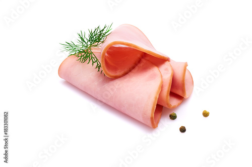 Cooked boiled ham sausage or rolled bologna slices isolated on white background with herbs and spices