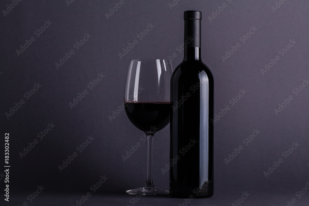 Red wine glass and bottle