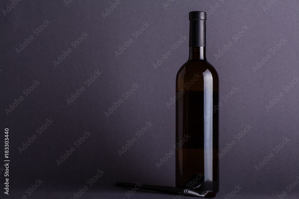 White wine bottle on grey