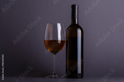 White wine glass and bottle