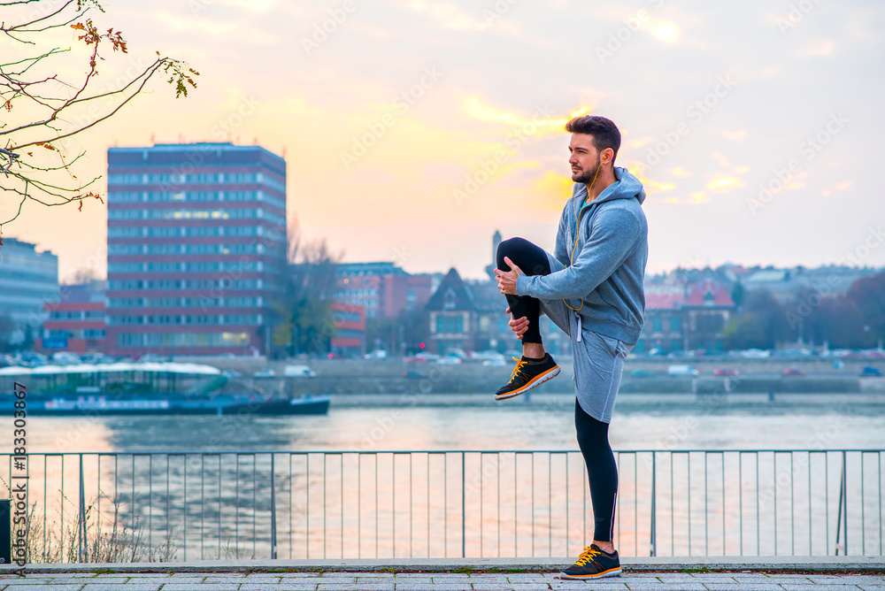 Young man stretching