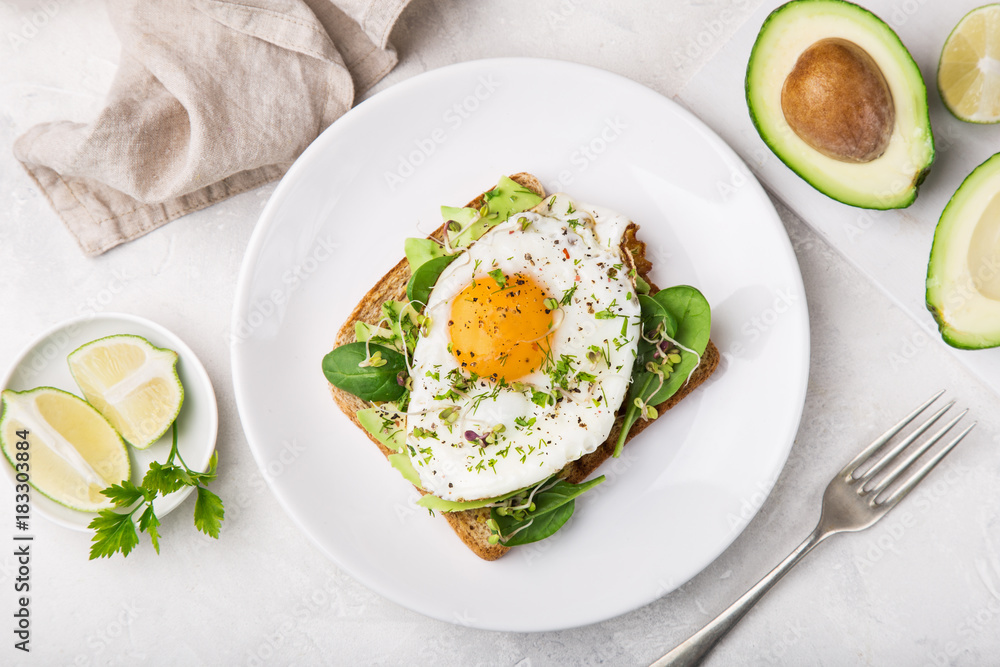 toast with avocado, spinach and fried egg toast with avocado, spinach and fried egg