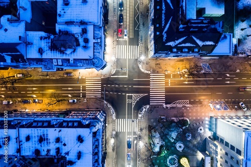 Aerial drone view on city intersection during winter night