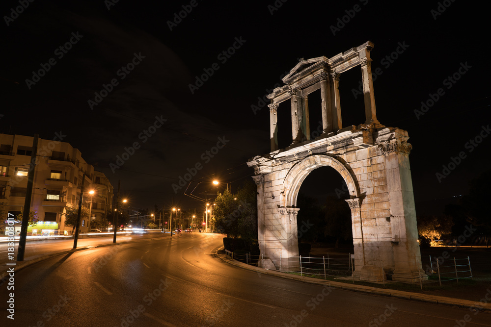 Night view Arch of Hadrian that leads to the pillars of Zeus's archaeological site.
