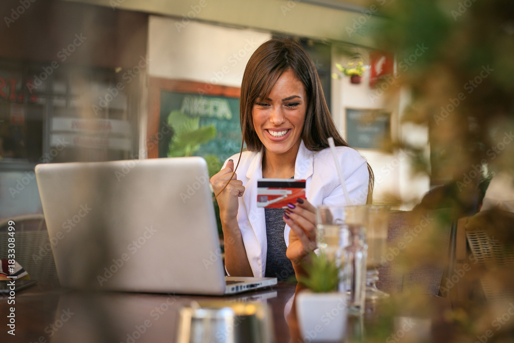 Woman checking count on credit card. Close up. Woman checking count on credit card. Close up.