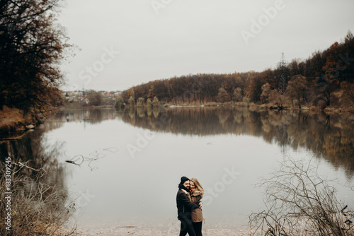 Loving couple at the lake, a love story, feeling beautiful, sunny and smiling, love